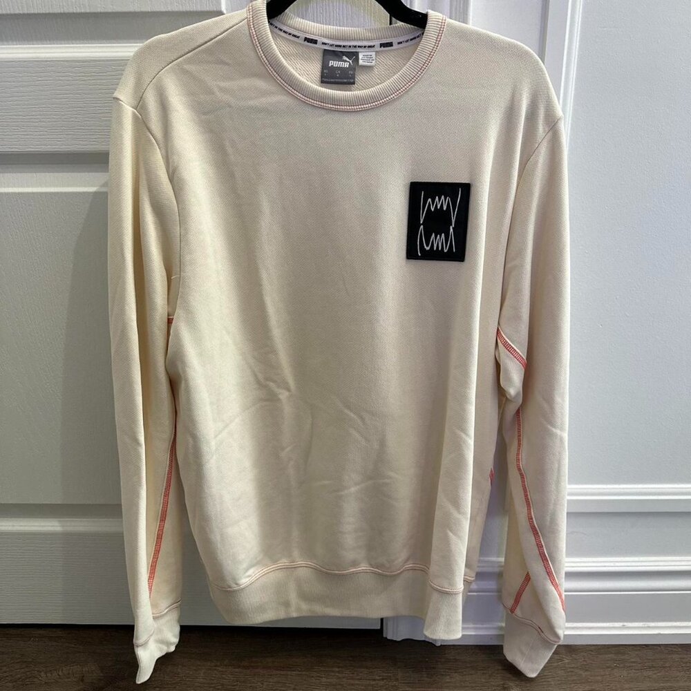 Cream Puma sweatshirt with red accents